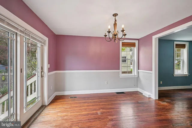 a view of a livingroom with wooden floor