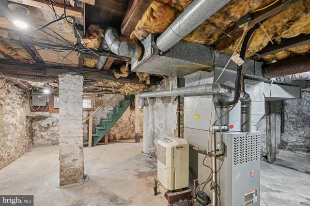 a bathroom with a shower and a sink