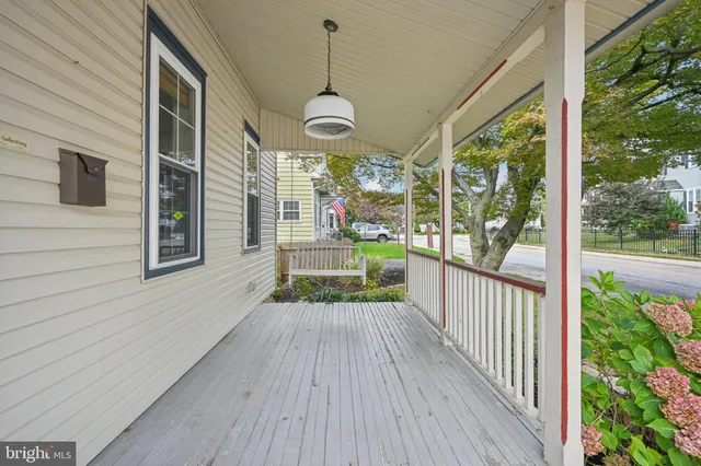 a view of a porch and wooden floor
