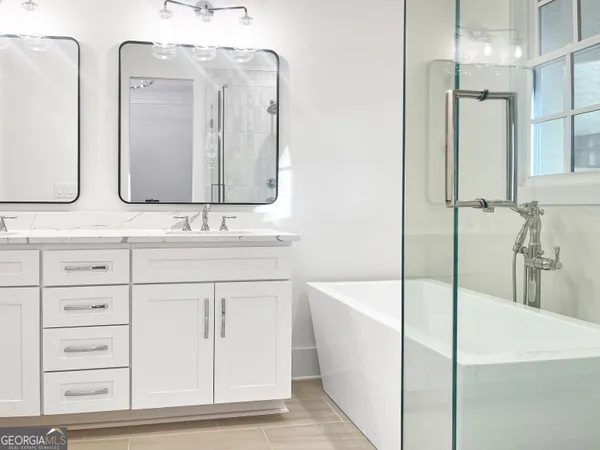 a bathroom with a sink and a shower