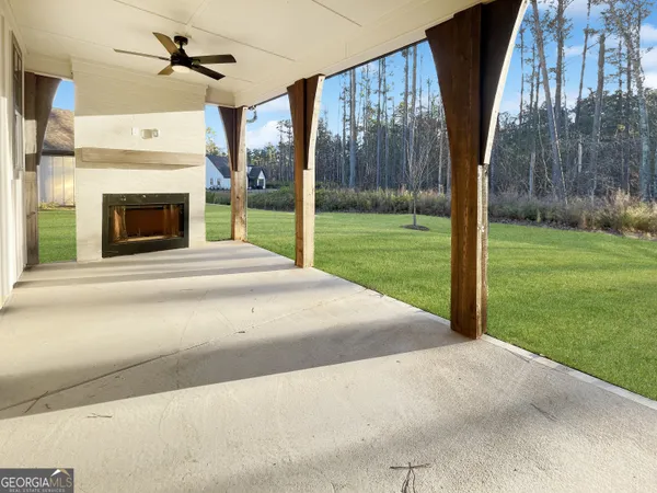 a view of a house with a yard and garage