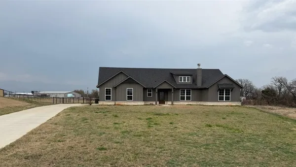 a house with trees in the background
