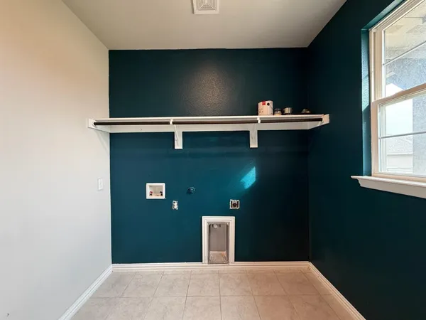 a view of a room with window and wooden floor