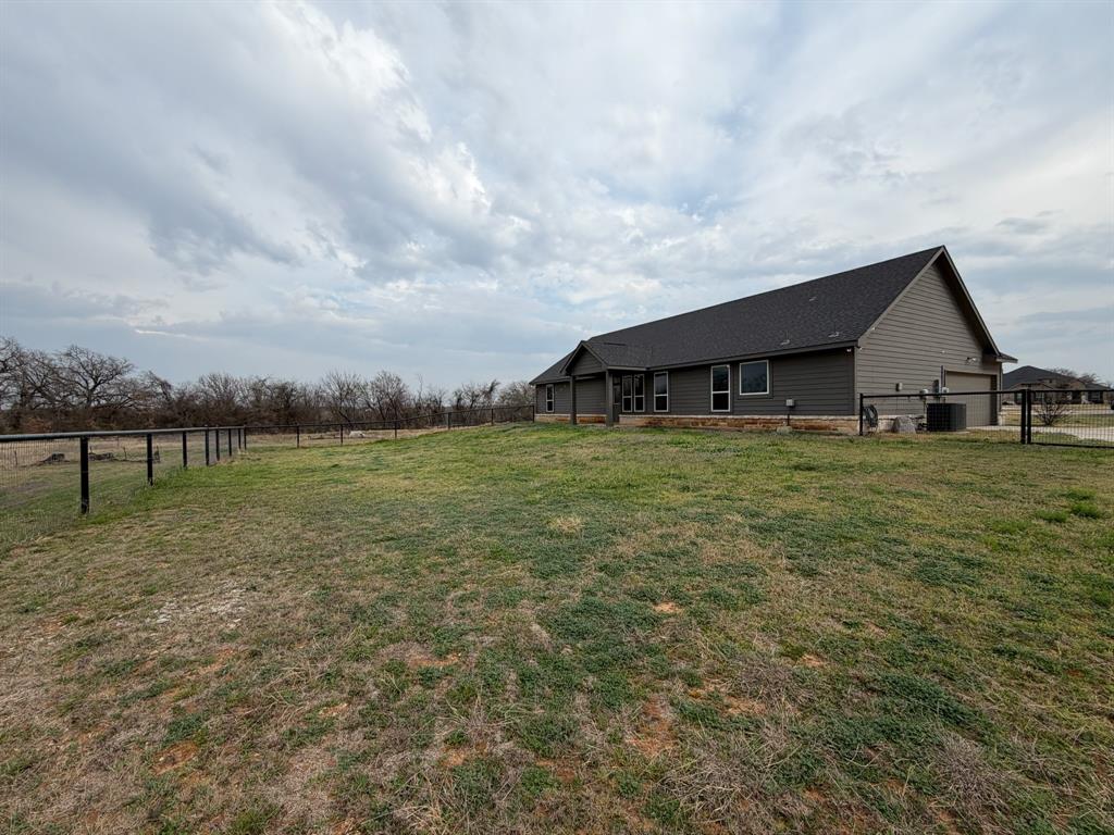 1035 Northern Oaks Court Springtown, TX 76082 - Photo 15 of 15 a view of a house with a yard