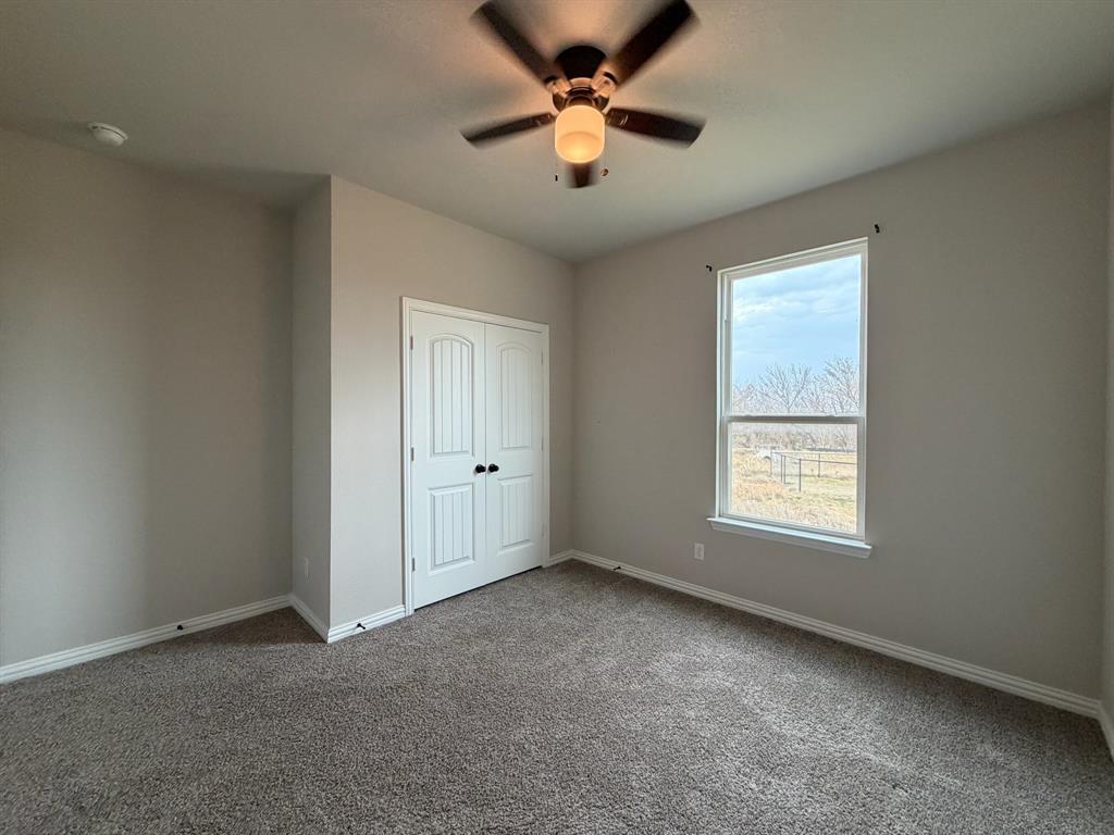 1035 Northern Oaks Court Springtown, TX 76082 - Photo 7 of 15 a view of an empty room with a window