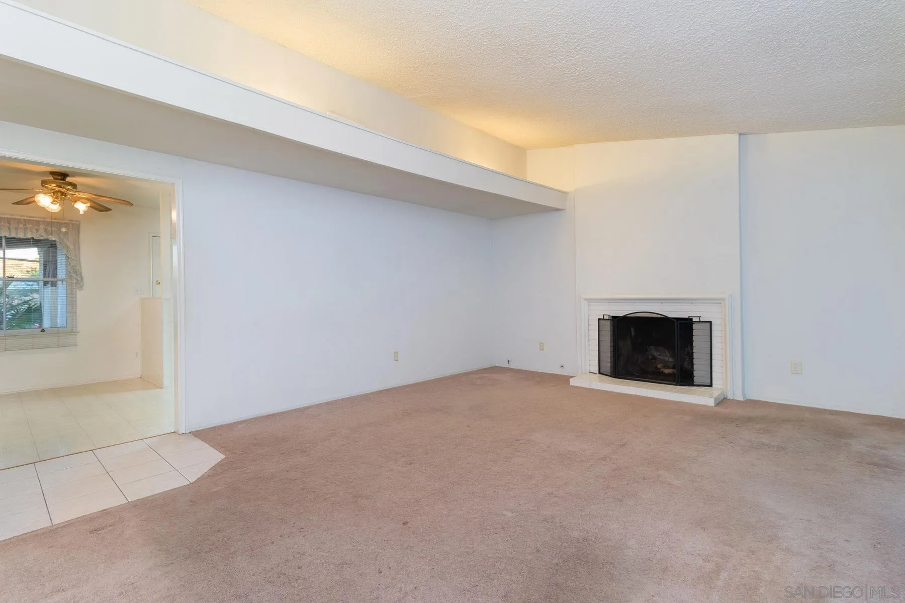 14184 Halper Road Poway, CA 92064 - Photo 4 of 20 an empty room with a fireplace