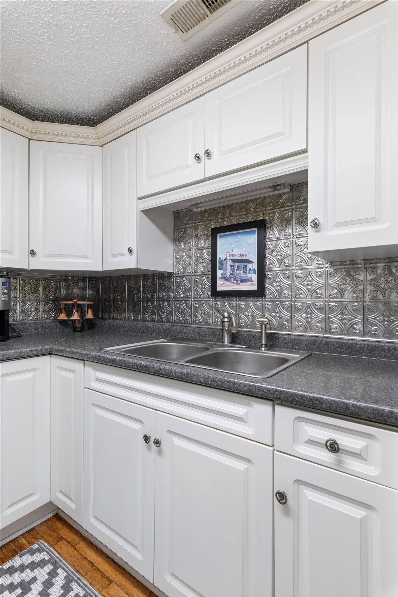 126 Blackey Bandy Road Bethpage, TN 37022 - Photo 12 of 37 a kitchen with stainless steel appliances granite countertop a sink a stove and cabinets