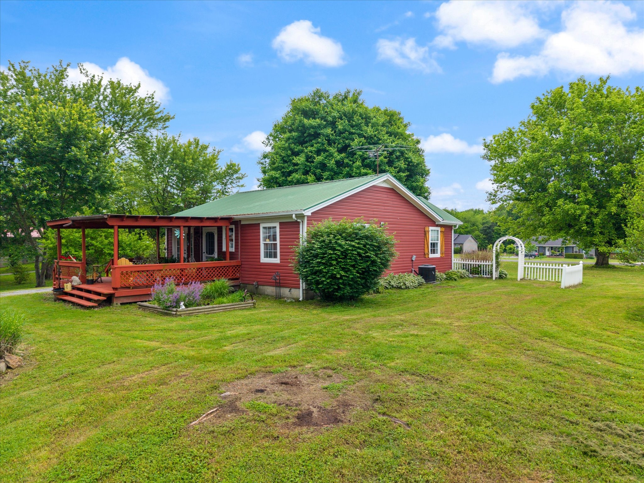 126 Blackey Bandy Road Bethpage, TN 37022 - Photo 21 of 37 a front view of a house with garden