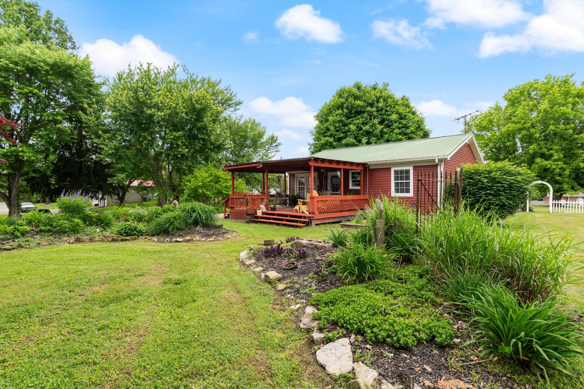 126 Blackey Bandy Road Bethpage, TN 37022 - Photo 28 of 37 a view of a house with swimming pool and garden