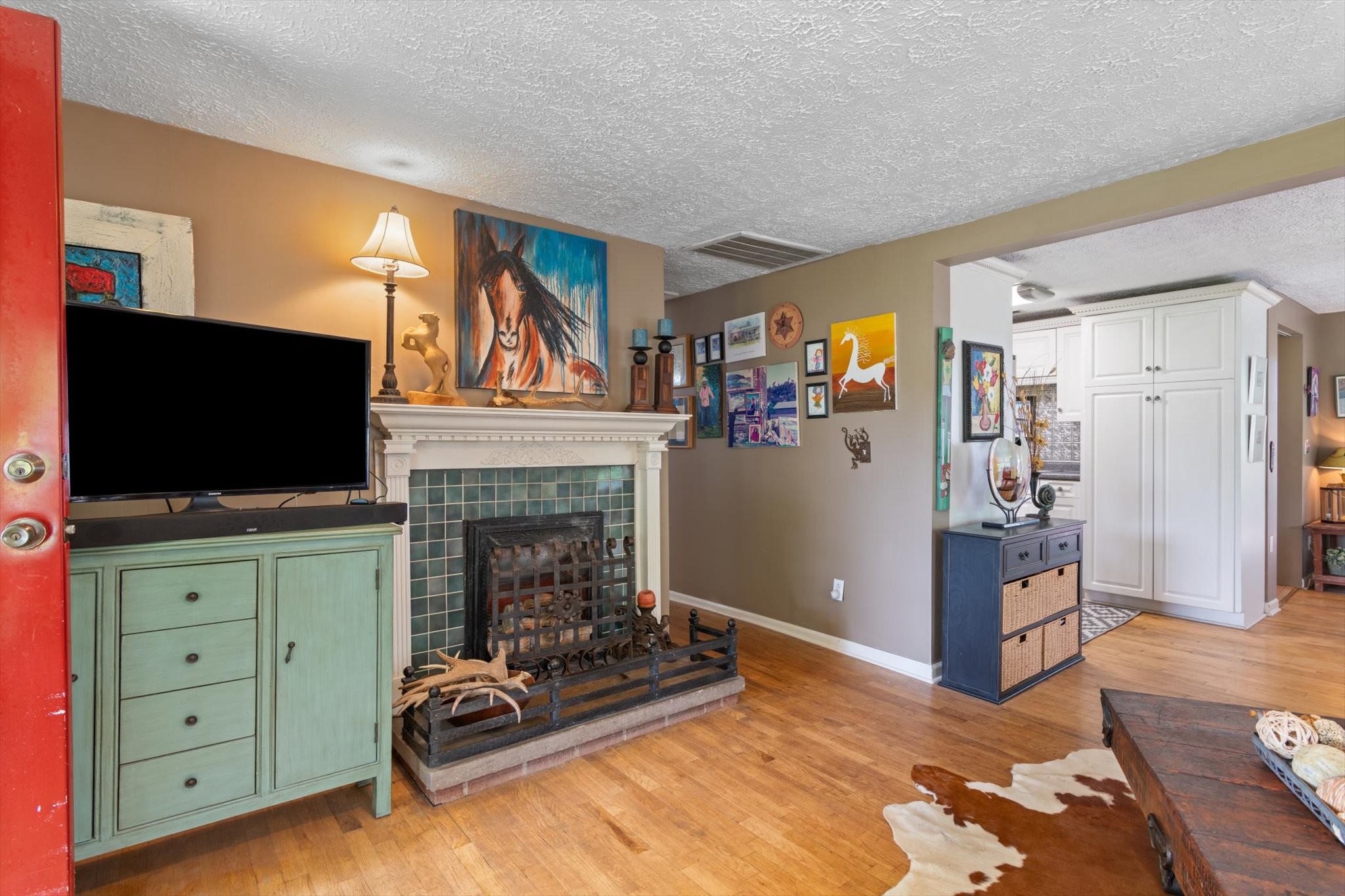 126 Blackey Bandy Road Bethpage, TN 37022 - Photo 4 of 37 a living room with furniture a flat screen tv and a fireplace