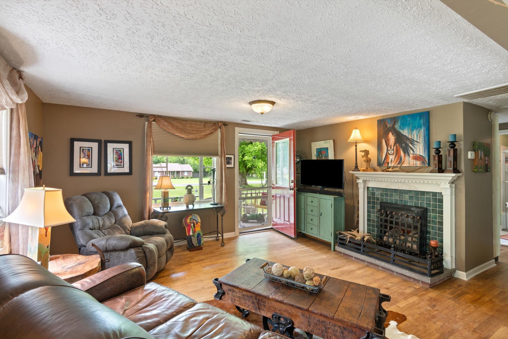 126 Blackey Bandy Road Bethpage, TN 37022 - Photo 5 of 37 a living room with furniture flat screen tv and a fireplace