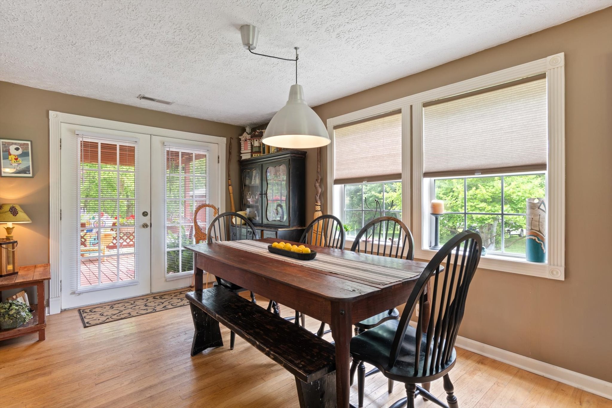 126 Blackey Bandy Road Bethpage, TN 37022 - Photo 8 of 37 a dining room with furniture wooden floor a chandelier and a rug