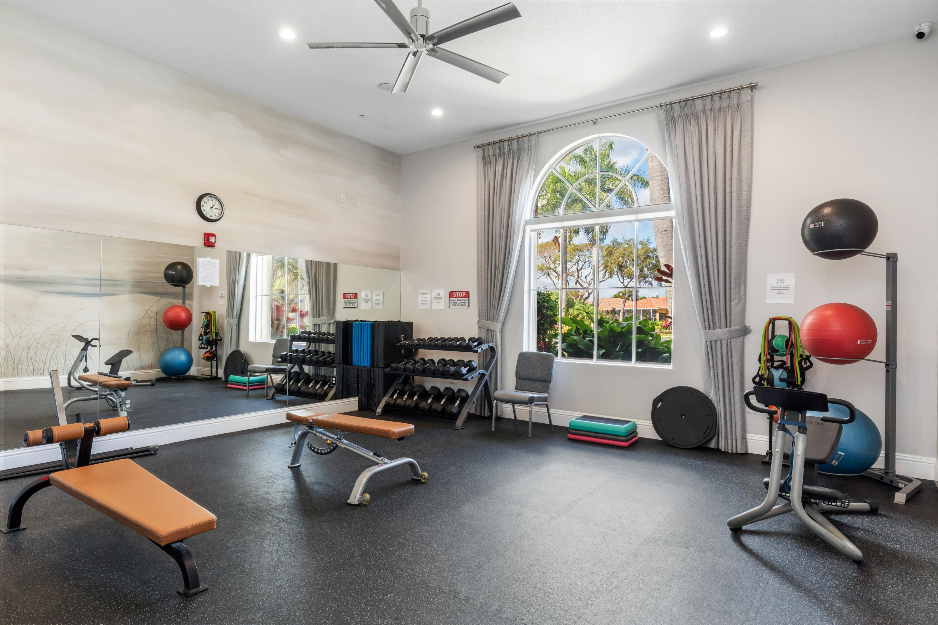 6698 Vía Roma Delray Beach, FL 33446 - Photo 35 of 50 a room with gym equipment and a large window