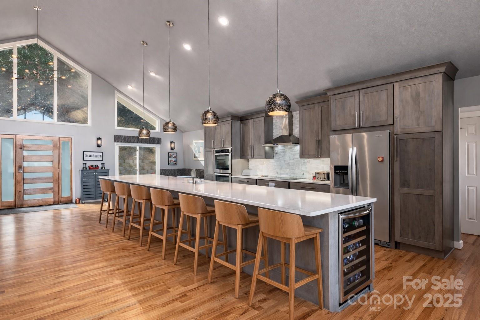 1591 Chestnut Flats Road Waynesville, NC 28786 - Photo 11 of 40 a large kitchen with a table and chairs