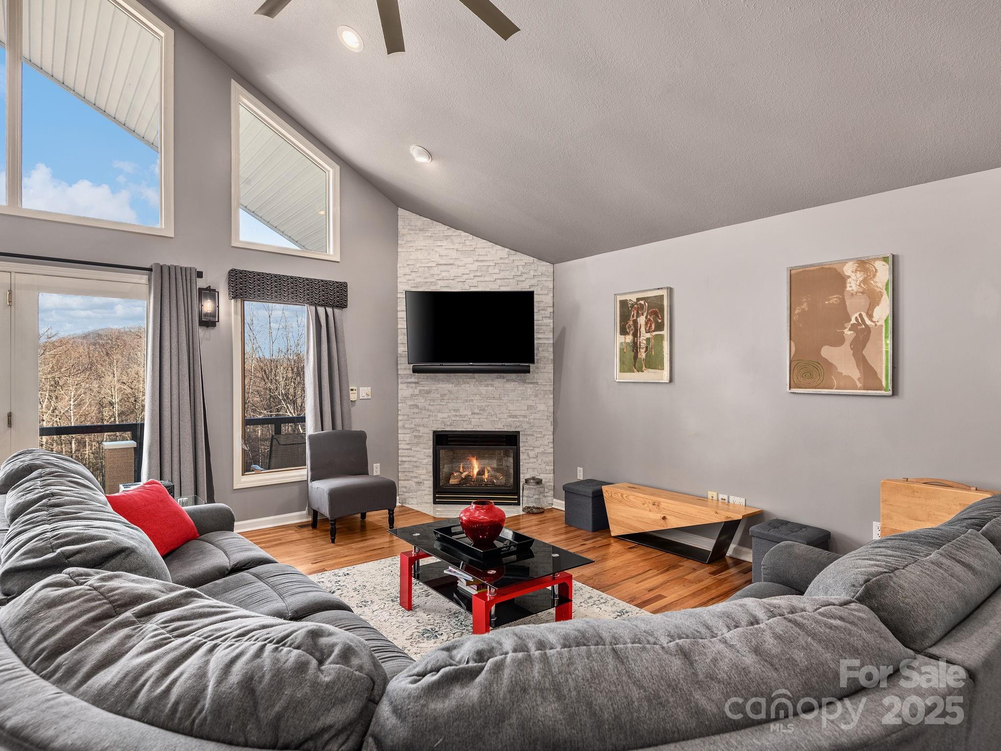 1591 Chestnut Flats Road Waynesville, NC 28786 - Photo 13 of 40 a bedroom with furniture and a fireplace