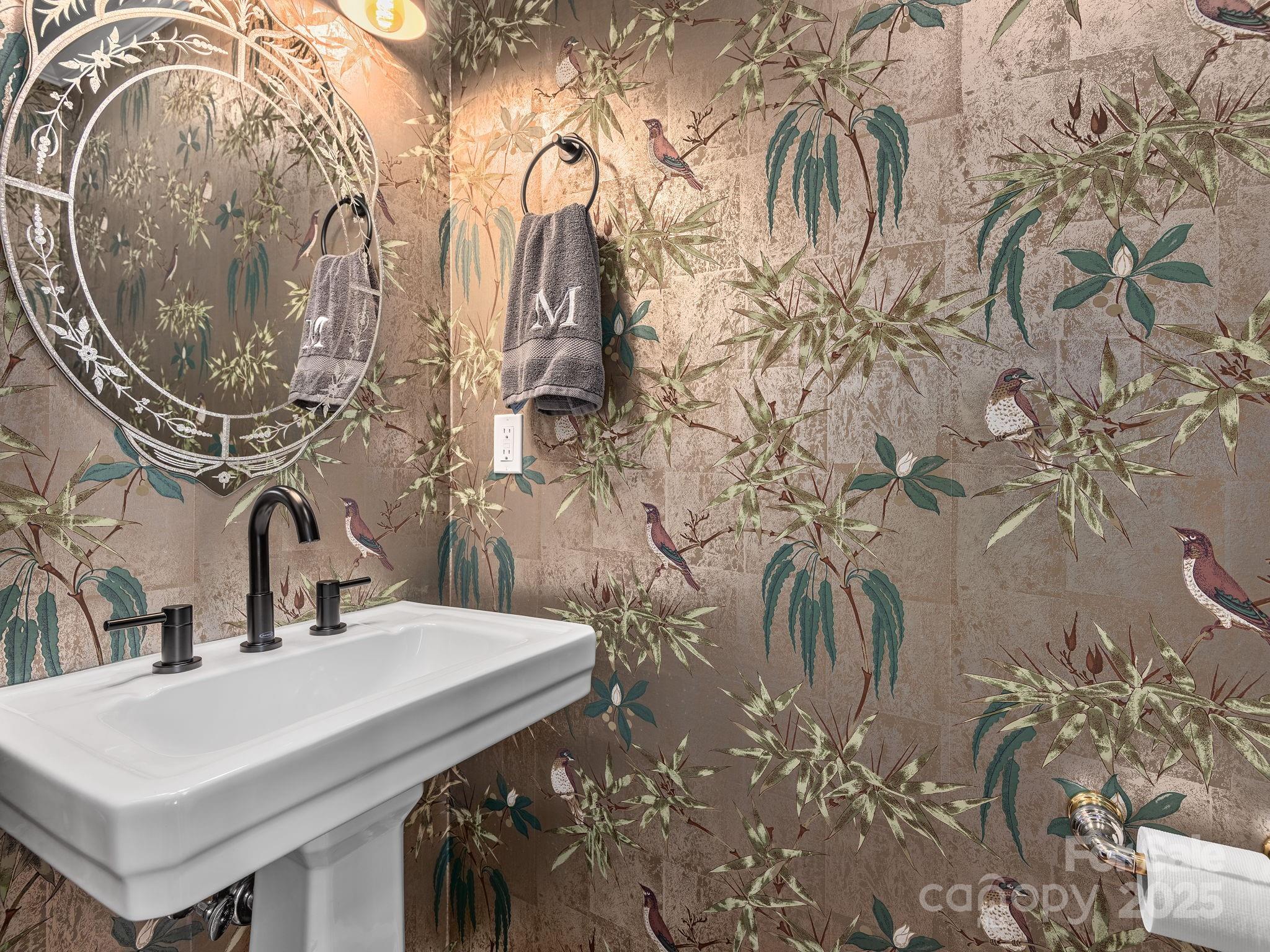 1591 Chestnut Flats Road Waynesville, NC 28786 - Photo 16 of 40 a bathroom with a sink and mirror with painted walls