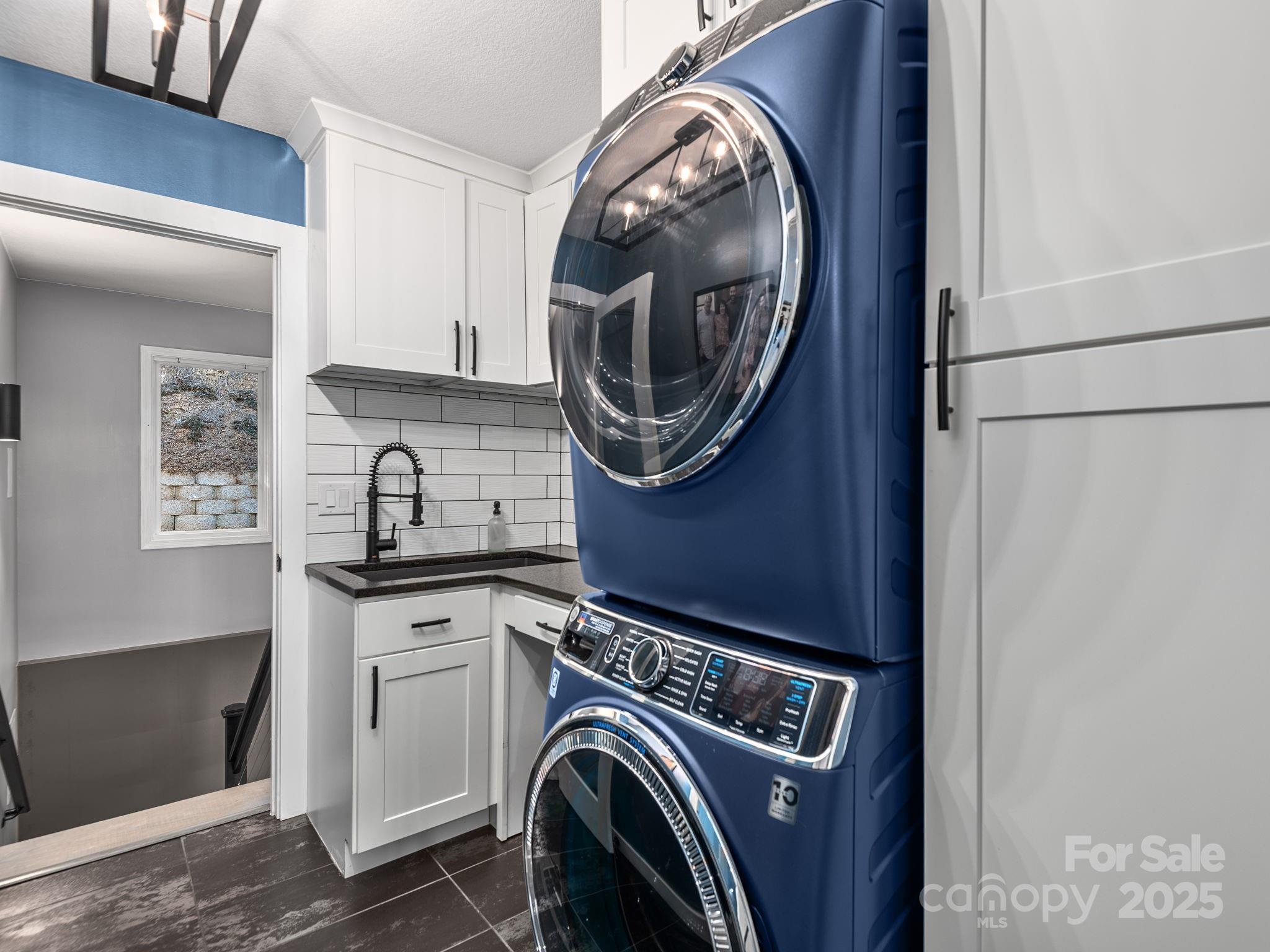 1591 Chestnut Flats Road Waynesville, NC 28786 - Photo 17 of 40 a utility room with dryer and washer