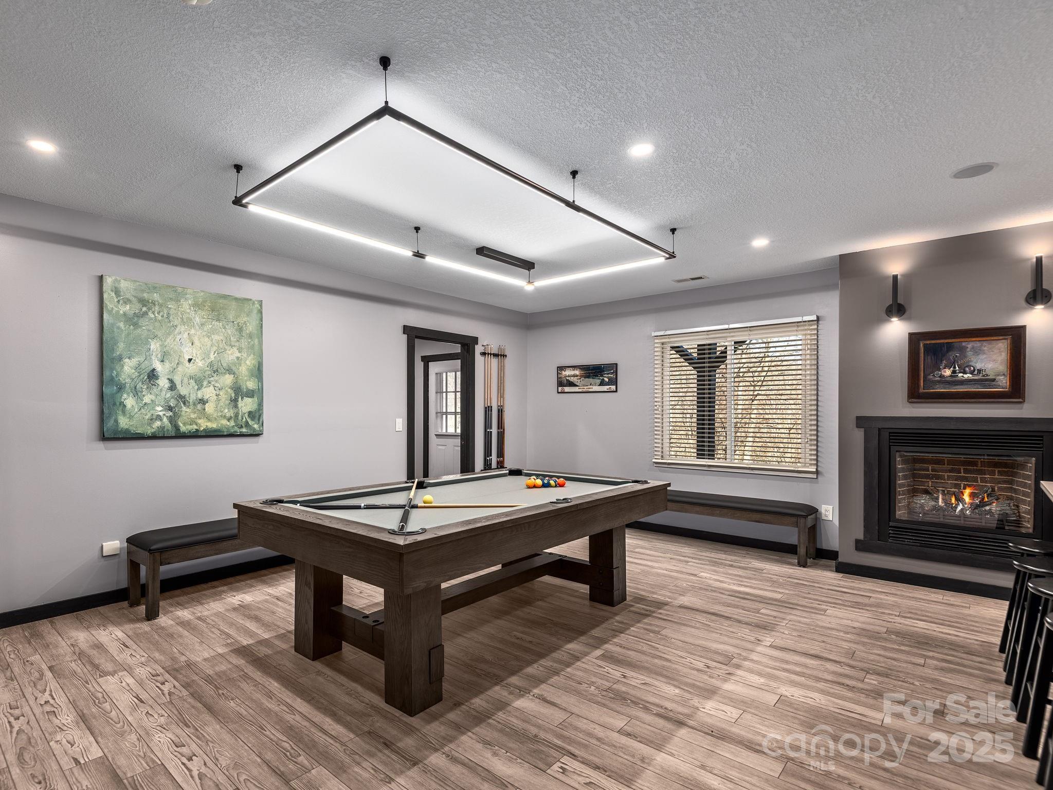 1591 Chestnut Flats Road Waynesville, NC 28786 - Photo 26 of 40 a living room with furniture a piano and a fireplace