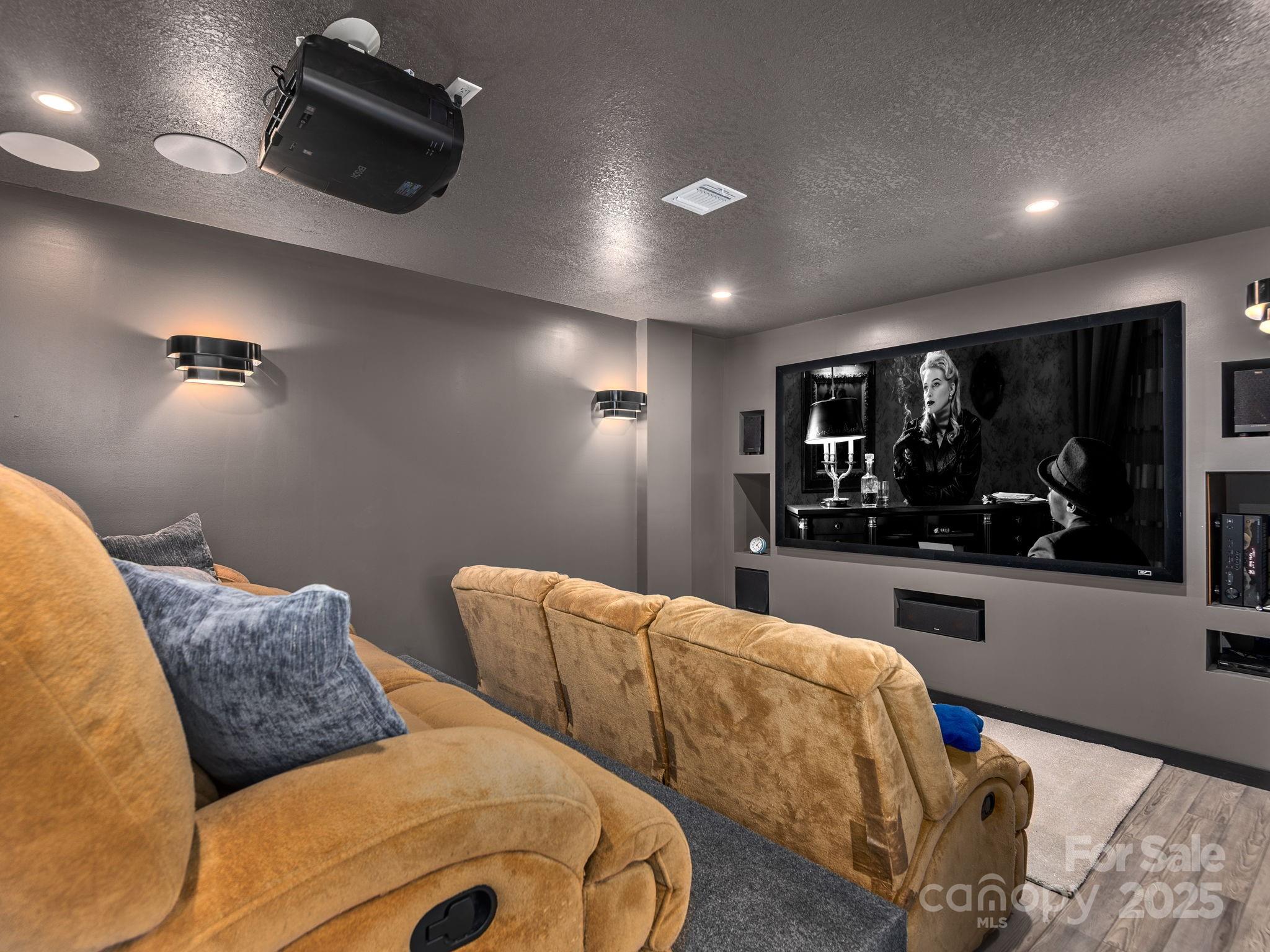 1591 Chestnut Flats Road Waynesville, NC 28786 - Photo 27 of 40 a living room with furniture and a flat screen tv