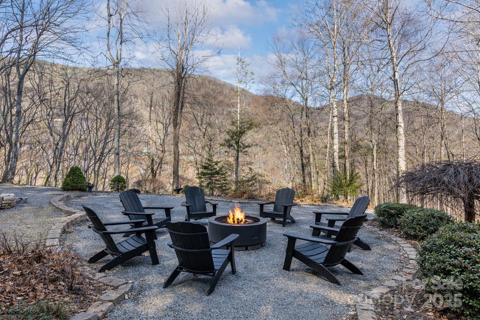 1591 Chestnut Flats Road Waynesville, NC 28786 - Photo 35 of 40 a view of a backyard with sitting area