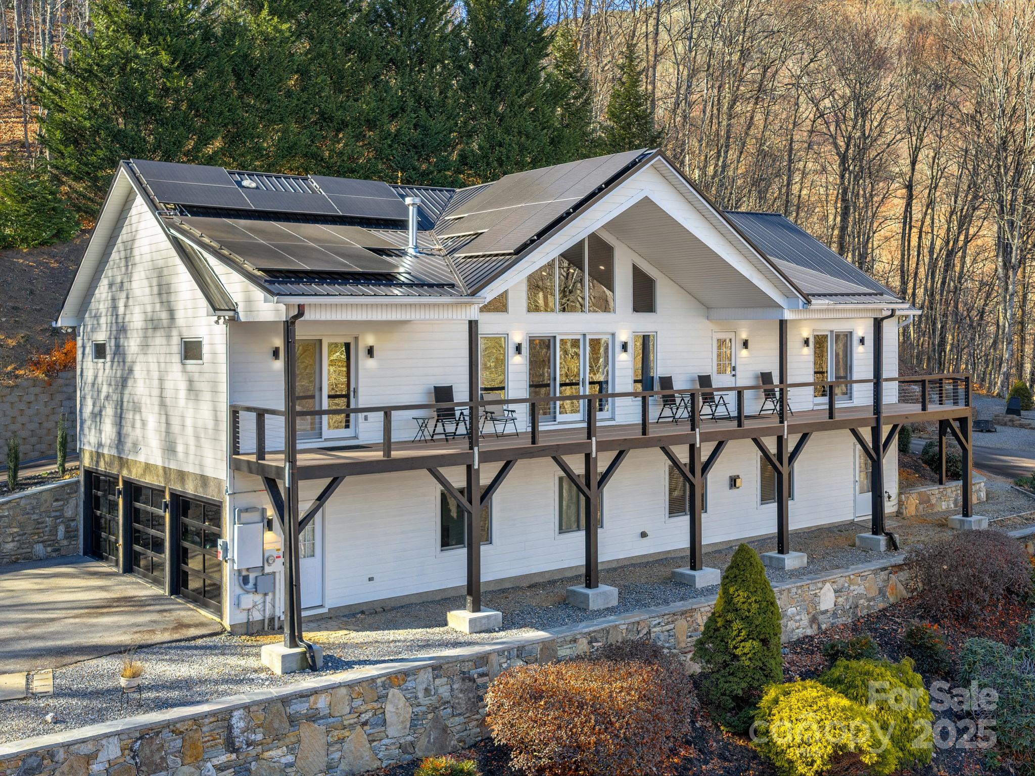 1591 Chestnut Flats Road Waynesville, NC 28786 - Photo 36 of 40 a house view with two tub and chairs