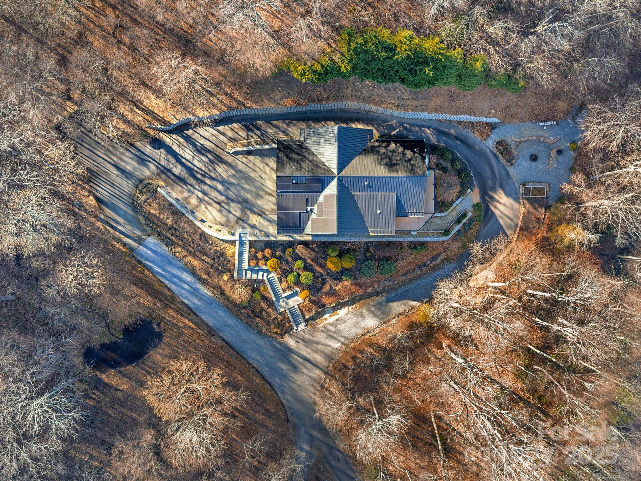 1591 Chestnut Flats Road Waynesville, NC 28786 - Photo 38 of 40 a view of a small house with roof