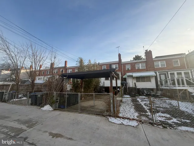 a front view of a house with parking space