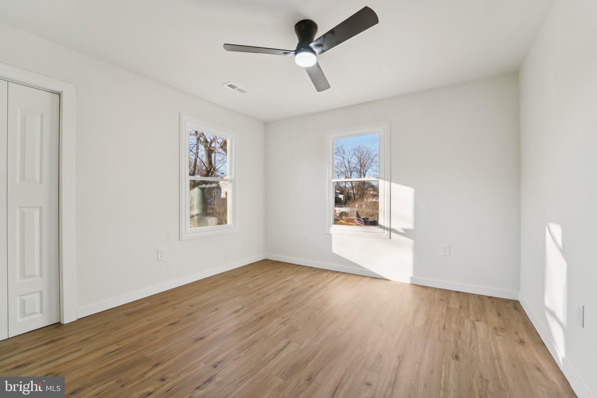 27 Pelczar Avenue Baltimore, MD 21221 - Photo 18 of 40 a view of empty room with wooden floor