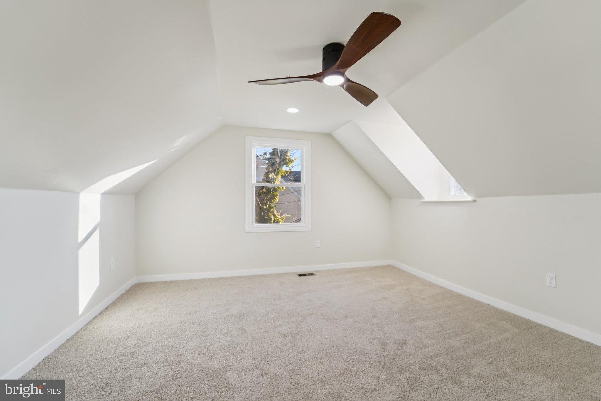27 Pelczar Avenue Baltimore, MD 21221 - Photo 23 of 40 an empty room with a ceiling fan and window