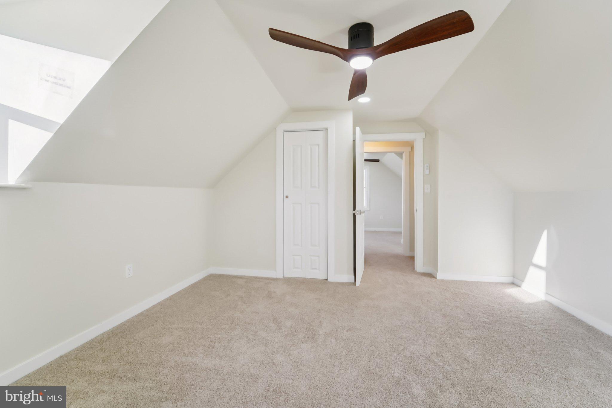 27 Pelczar Avenue Baltimore, MD 21221 - Photo 24 of 40 an empty room with ceiling fan and window