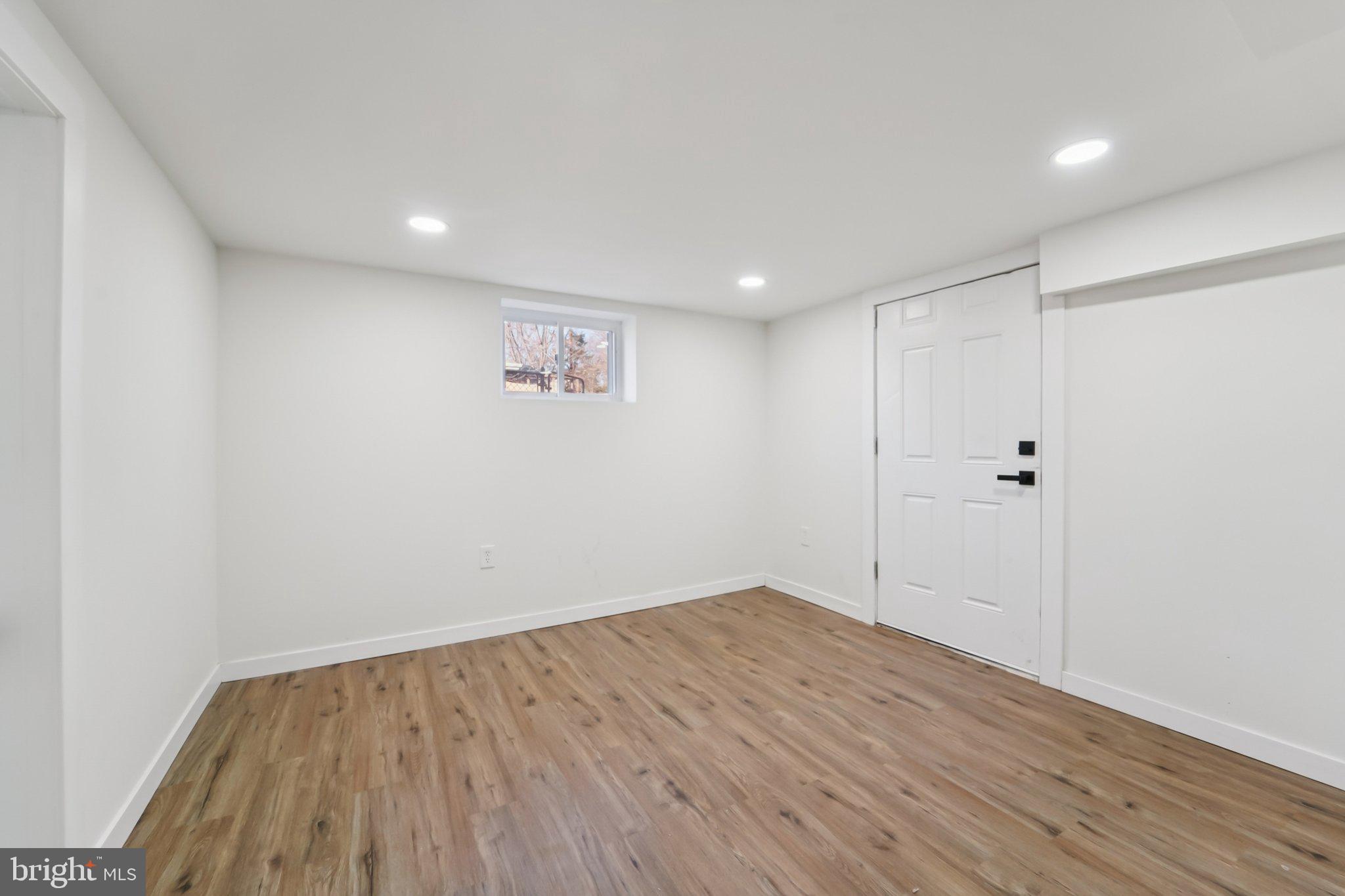 27 Pelczar Avenue Baltimore, MD 21221 - Photo 32 of 40 a view of room with wooden floor