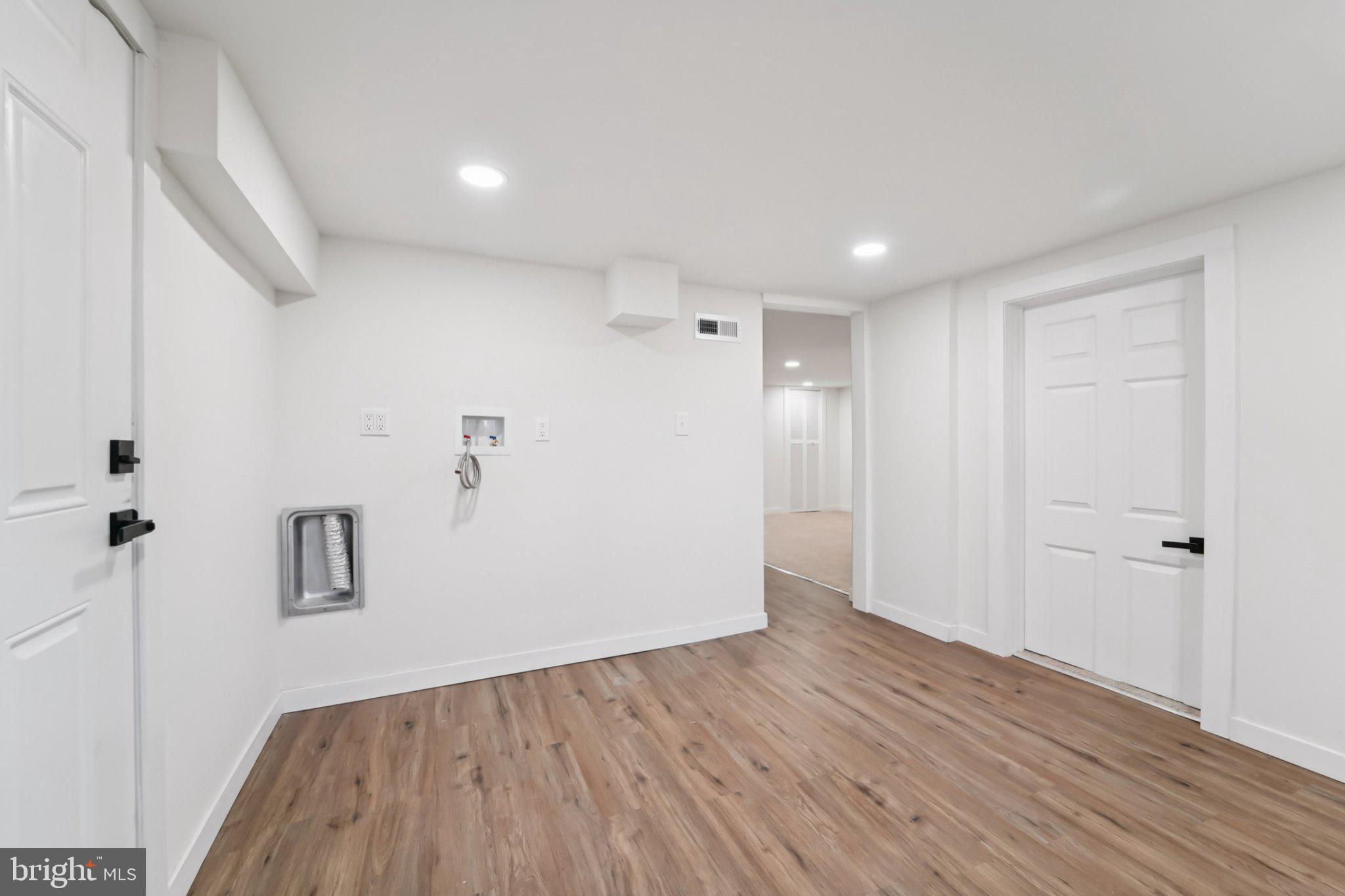 27 Pelczar Avenue Baltimore, MD 21221 - Photo 33 of 40 a view of room with wooden floor