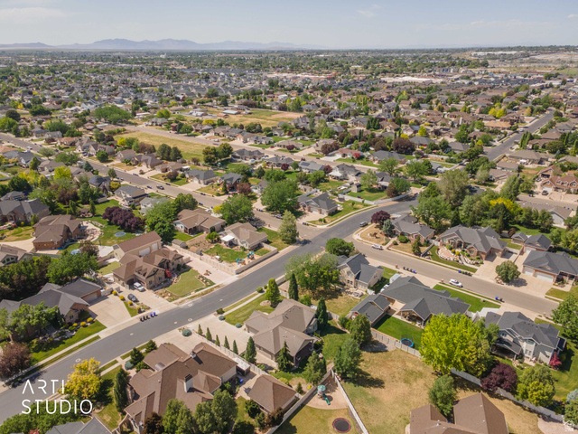 2327 Bluff Ridge Drive Syracuse, UT 84075 - Photo 64 of 66 Sprawling residential neighborhood with established homes, mature landscaping, and paved streets