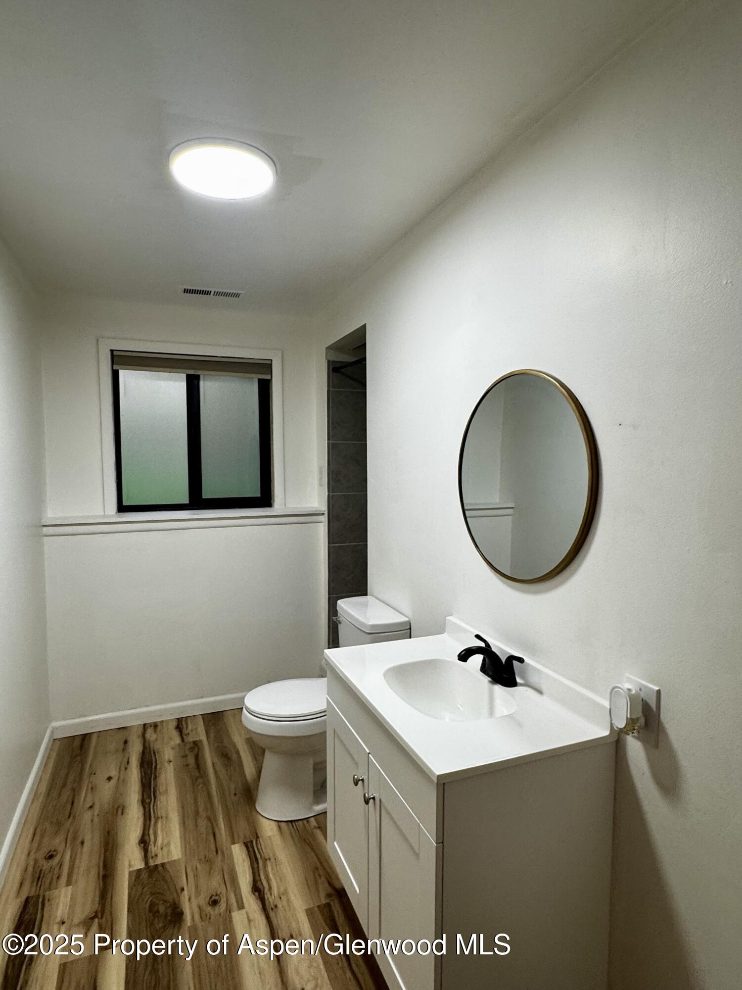 228 North 7th Street New Castle, CO 81647 - Photo 13 of 24 a bathroom with a sink and a mirror