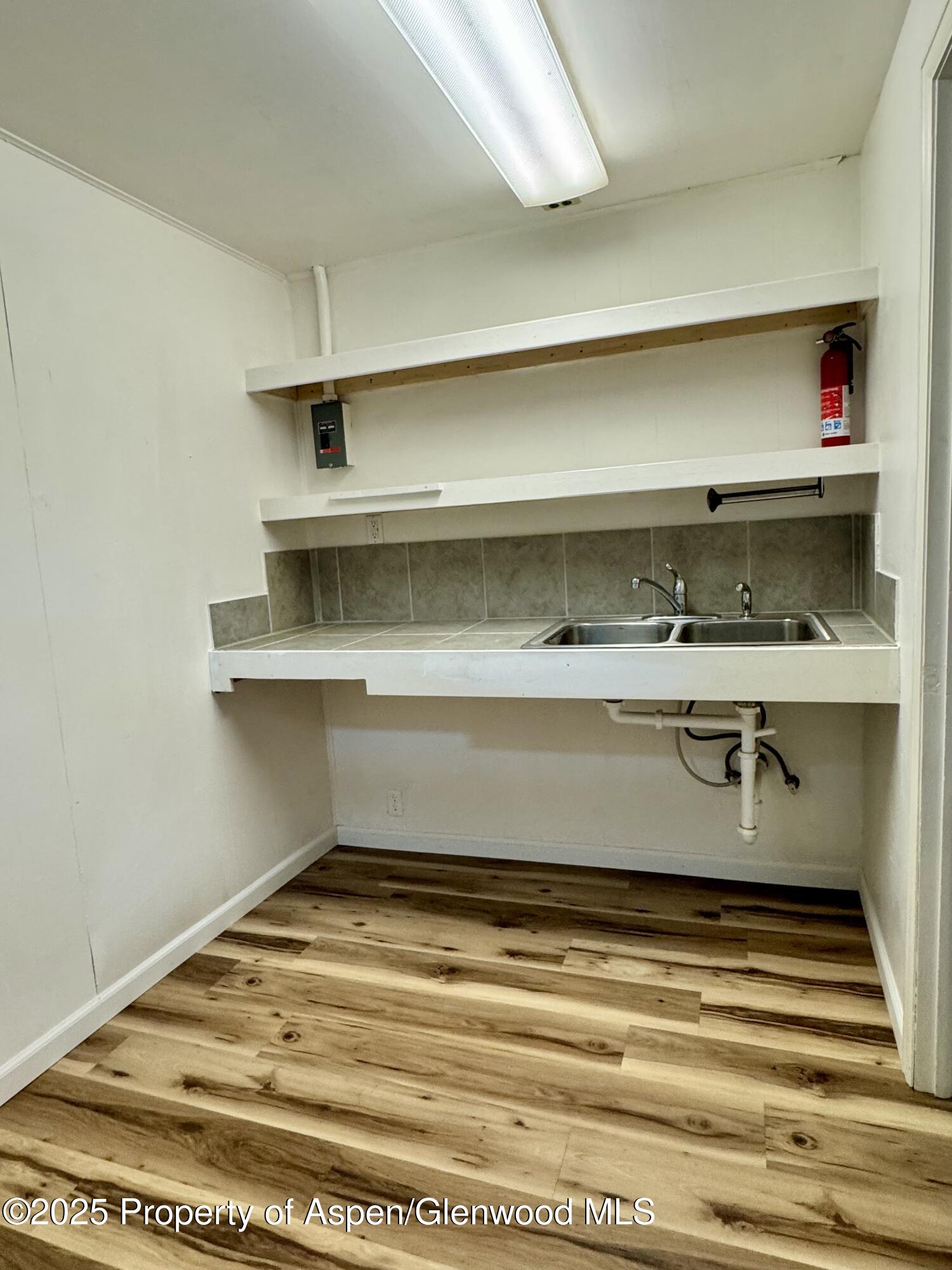 228 North 7th Street New Castle, CO 81647 - Photo 16 of 24 a room with kitchen appliances