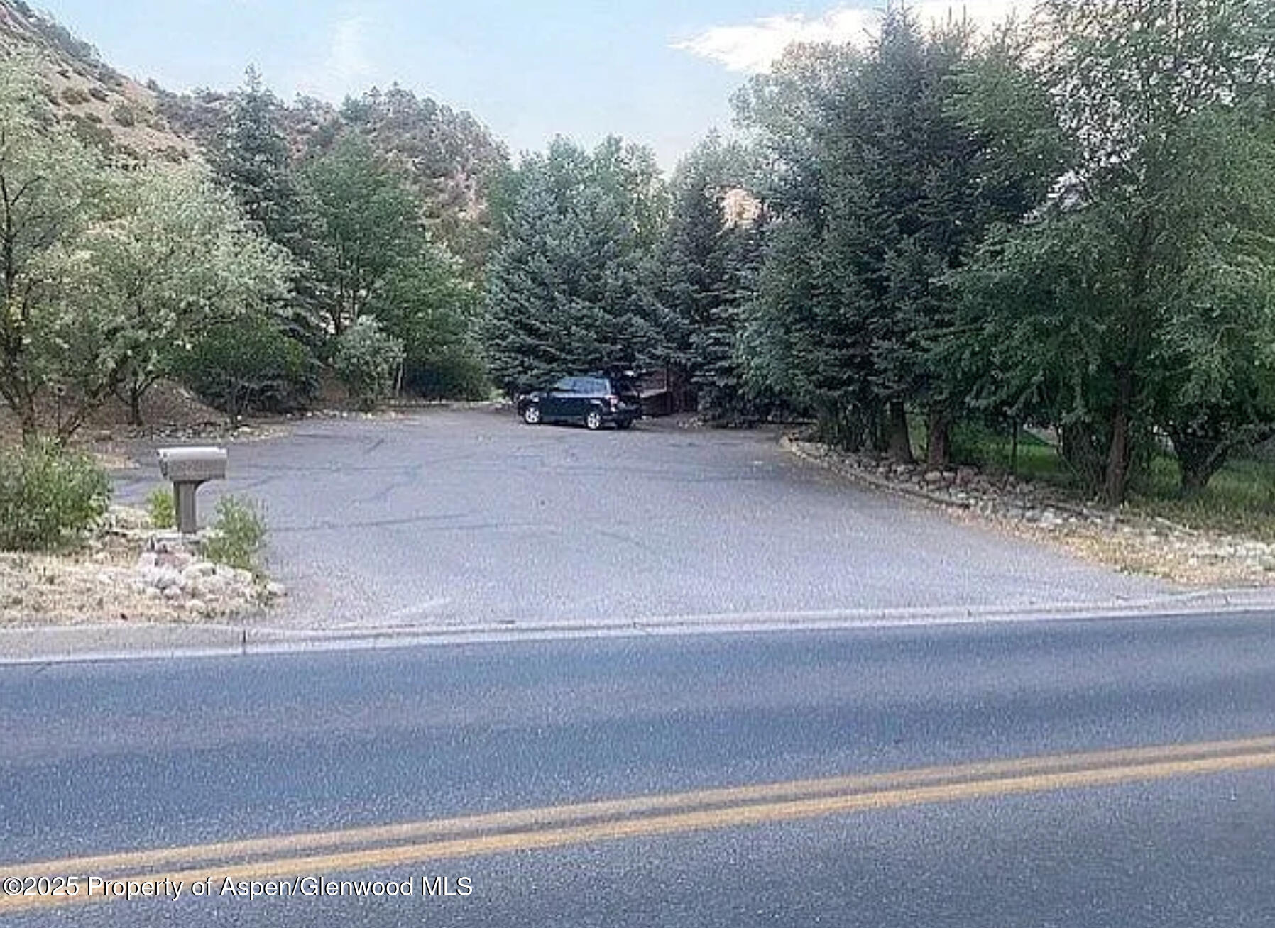 228 North 7th Street New Castle, CO 81647 - Photo 22 of 24 a view of a house with a yard