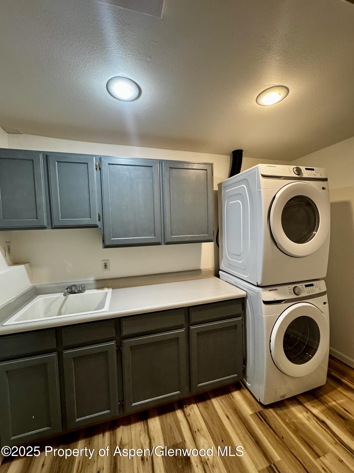 228 North 7th Street New Castle, CO 81647 - Photo 9 of 24 a utility room with sink dryer and washer