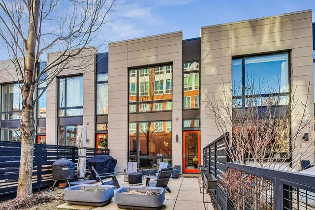 a view of a patio with couches and potted plants
