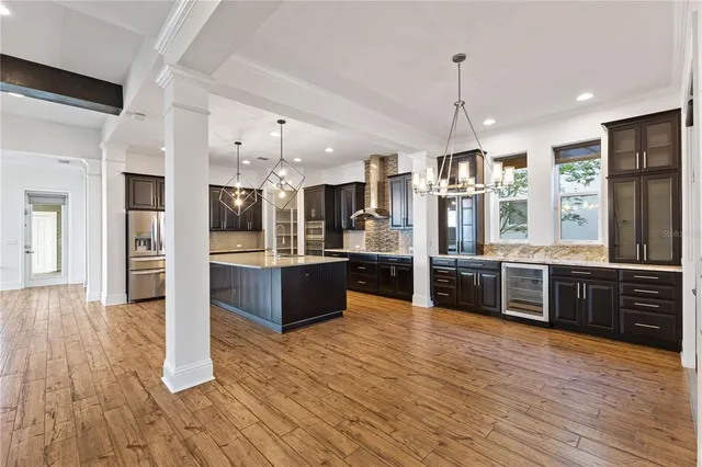 a kitchen with granite countertop a stove and a sink