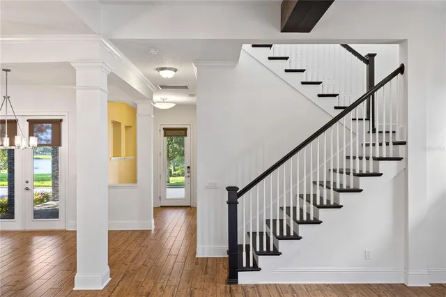 a view of a house with wooden floor in front of it