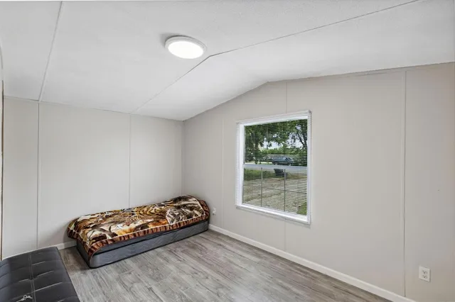 a room with a bed and a window