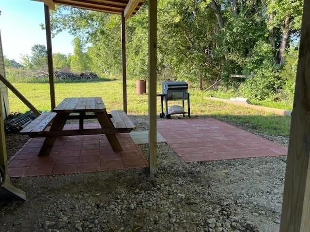 a view of a backyard of the house