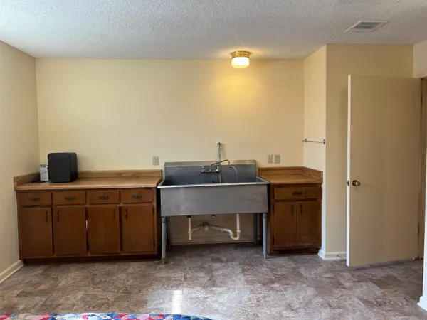 a bathroom with a sink and vanity