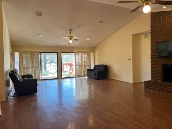 a bedroom with a bed and a chair