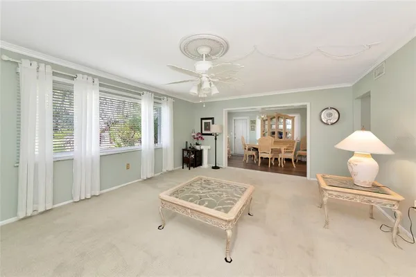 a living room with furniture and a table