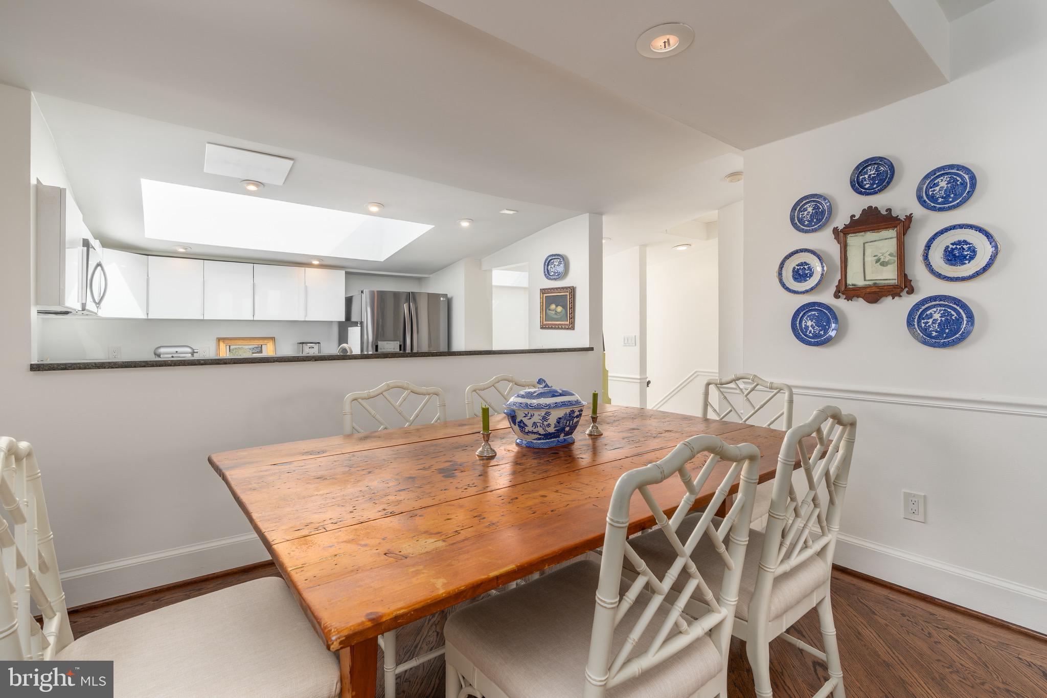 2115 S Street Northwest, Unit 3A Washington, DC 20008 - Photo 14 of 26 a dining room with furniture and wooden floor