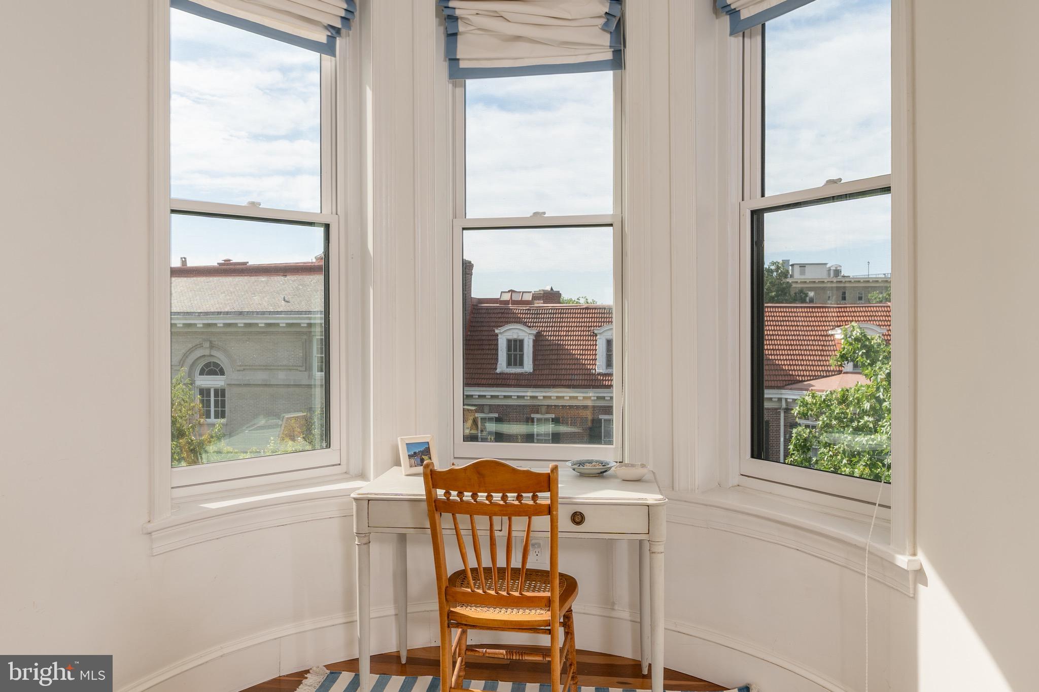 2115 S Street Northwest, Unit 3A Washington, DC 20008 - Photo 18 of 26 a view of a chair and table in a bedroom