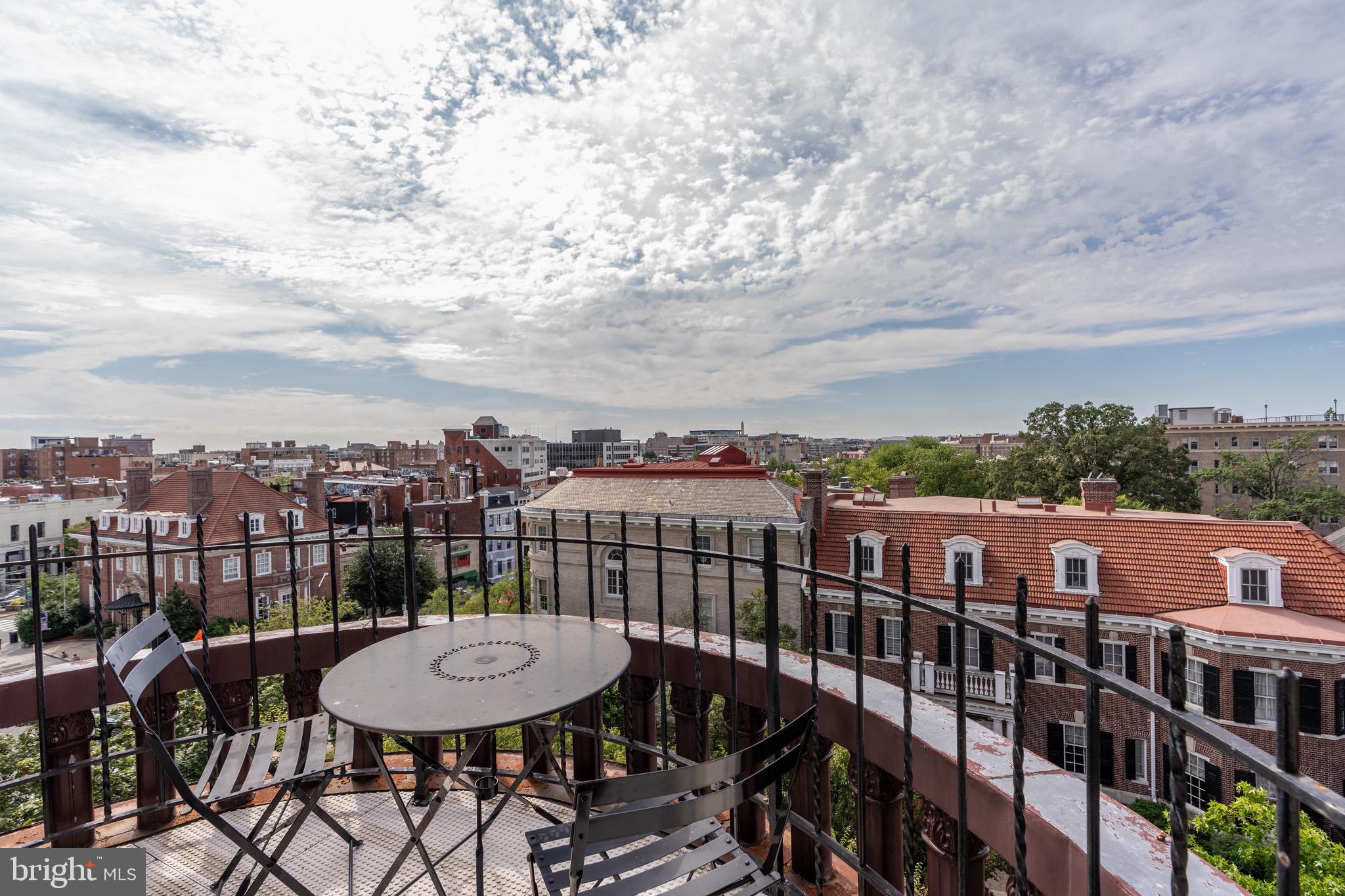 2115 S Street Northwest, Unit 3A Washington, DC 20008 - Photo 6 of 26 a view of a balcony with a table and chairs