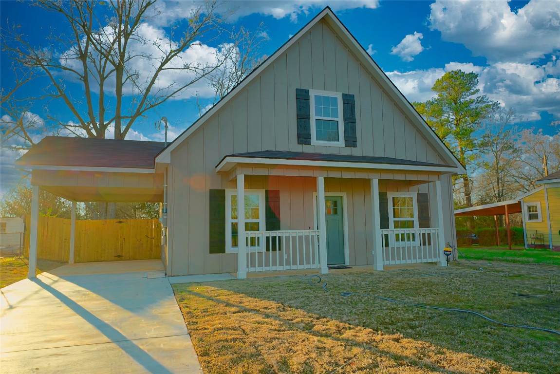 233 Harrison Street Longview, TX 75601 - Photo 2 of 24 a view of a house with a yard