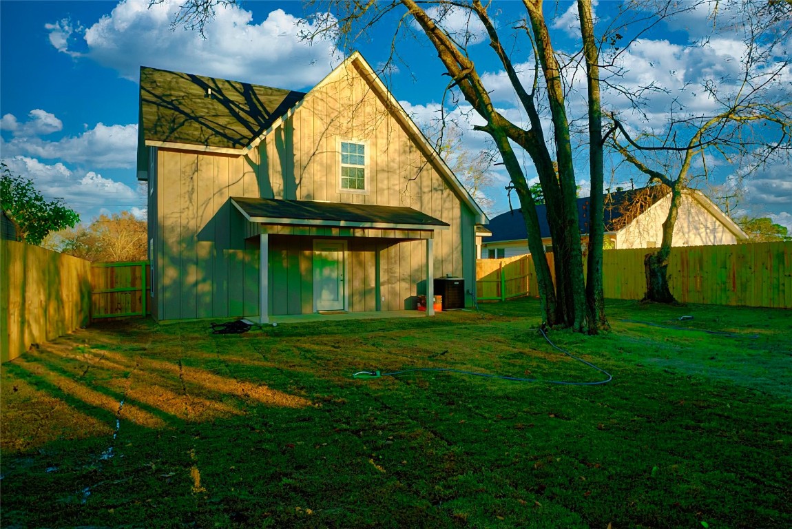 233 Harrison Street Longview, TX 75601 - Photo 24 of 24 a view of a big house in a big yard with large trees